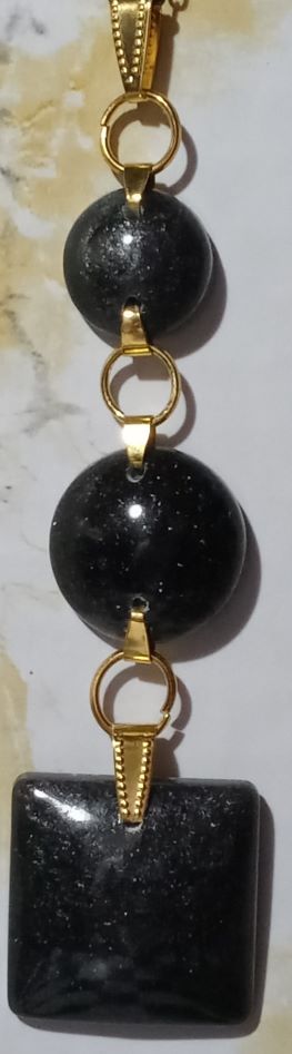 Three tier pendant with black first and second tier half circles connected to a black square at third tier.